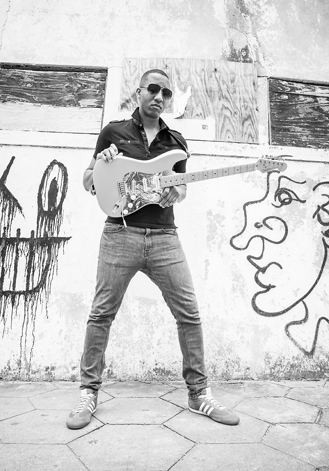 elliot holden-guitar-bw-graffiti wall