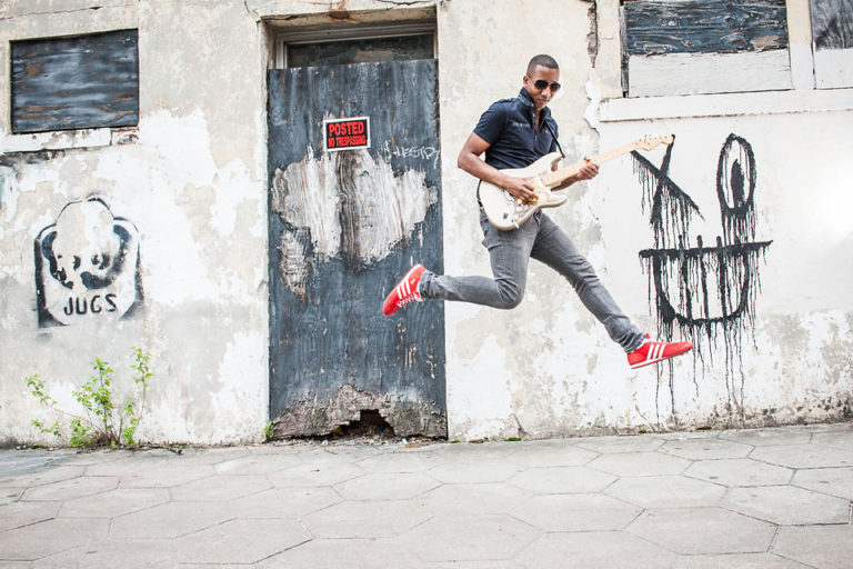 elliot holden-street-graffiti wall-guitar jump
